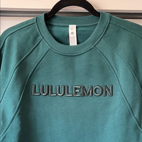 lululemon athletica Tops - NWT Lululemon Scuba Oversized Wordmark Logo Pullover, size M/L, Storm Teal color